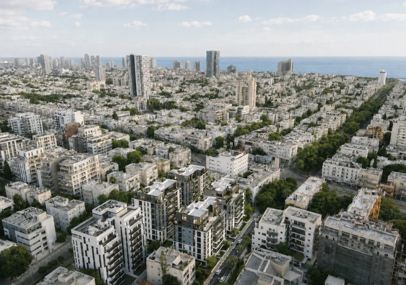 מבט אווירי על צפון תל אביב – בנייני הפרויקט בין רחובות ירוקים, מגדלי העיר והים ברקע